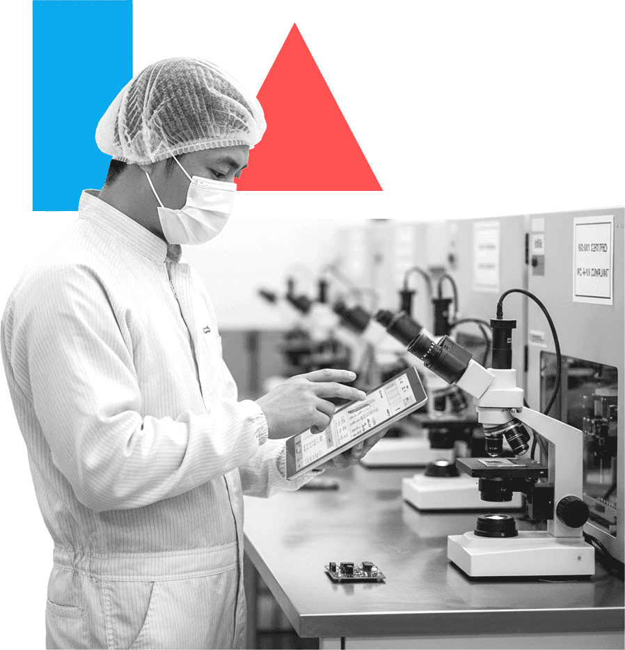 Professional reviewing quality data in electronics manufacturing facility