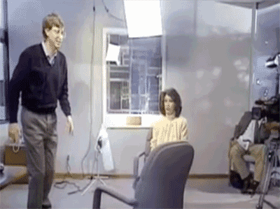 bill gates jumping over a chair