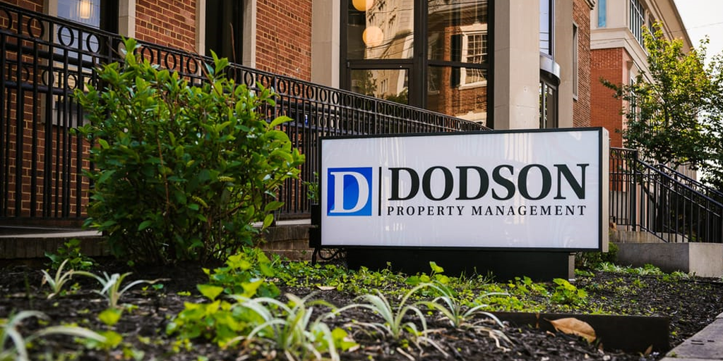 dodson property management sign