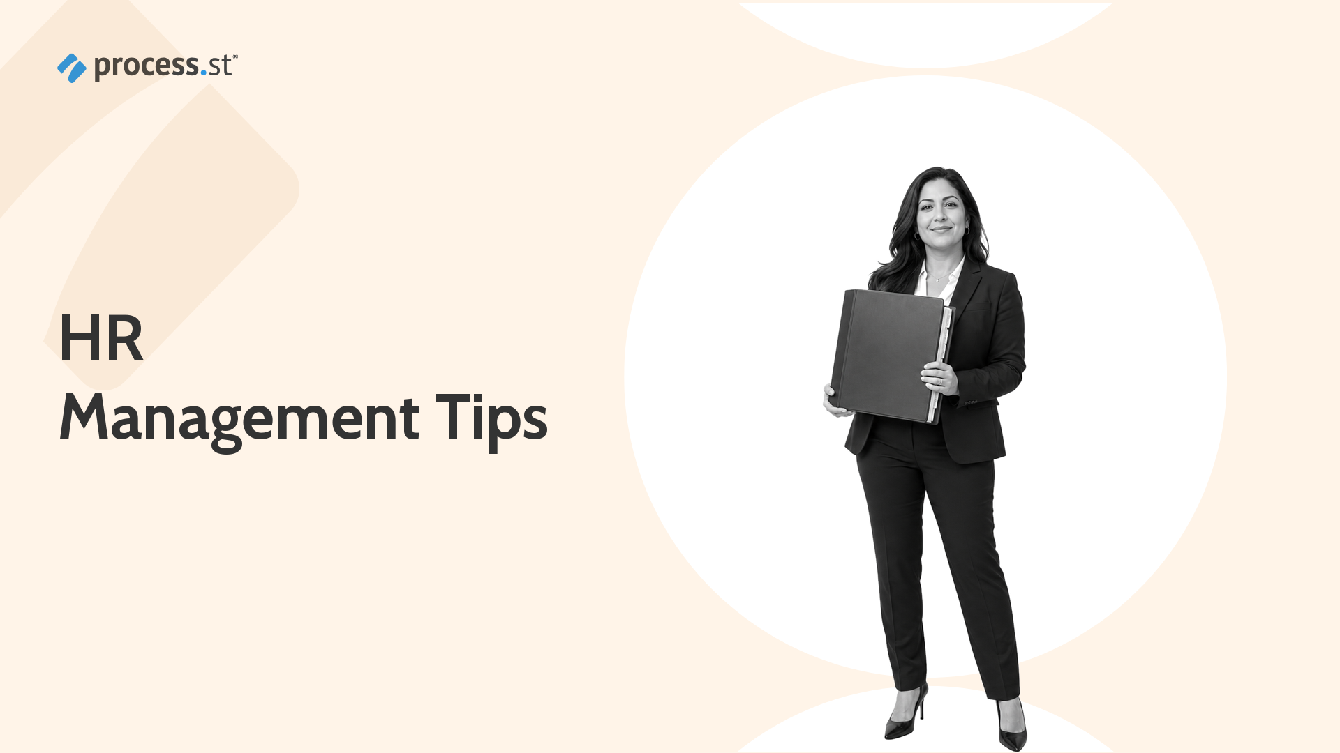 HR manager holding a structured employee handbook binder for HR management tips