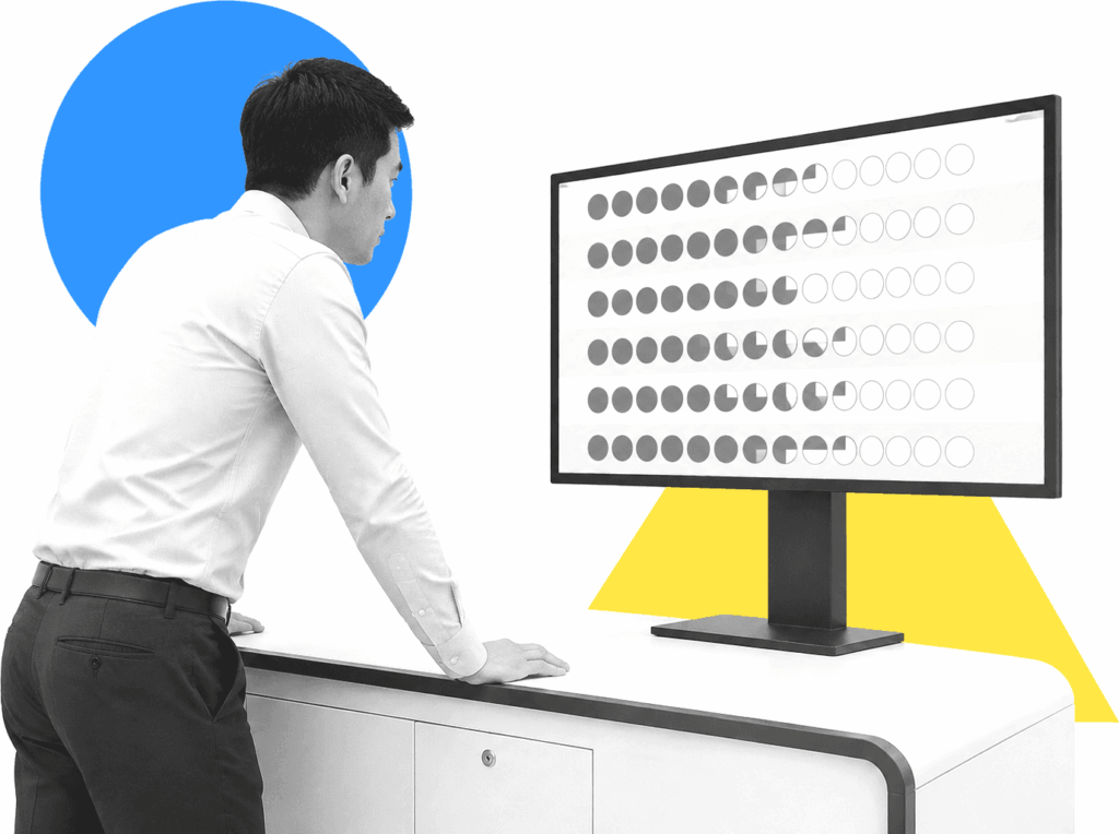 Compliance manager reviewing SOP tracking progress on a tablet beside status records