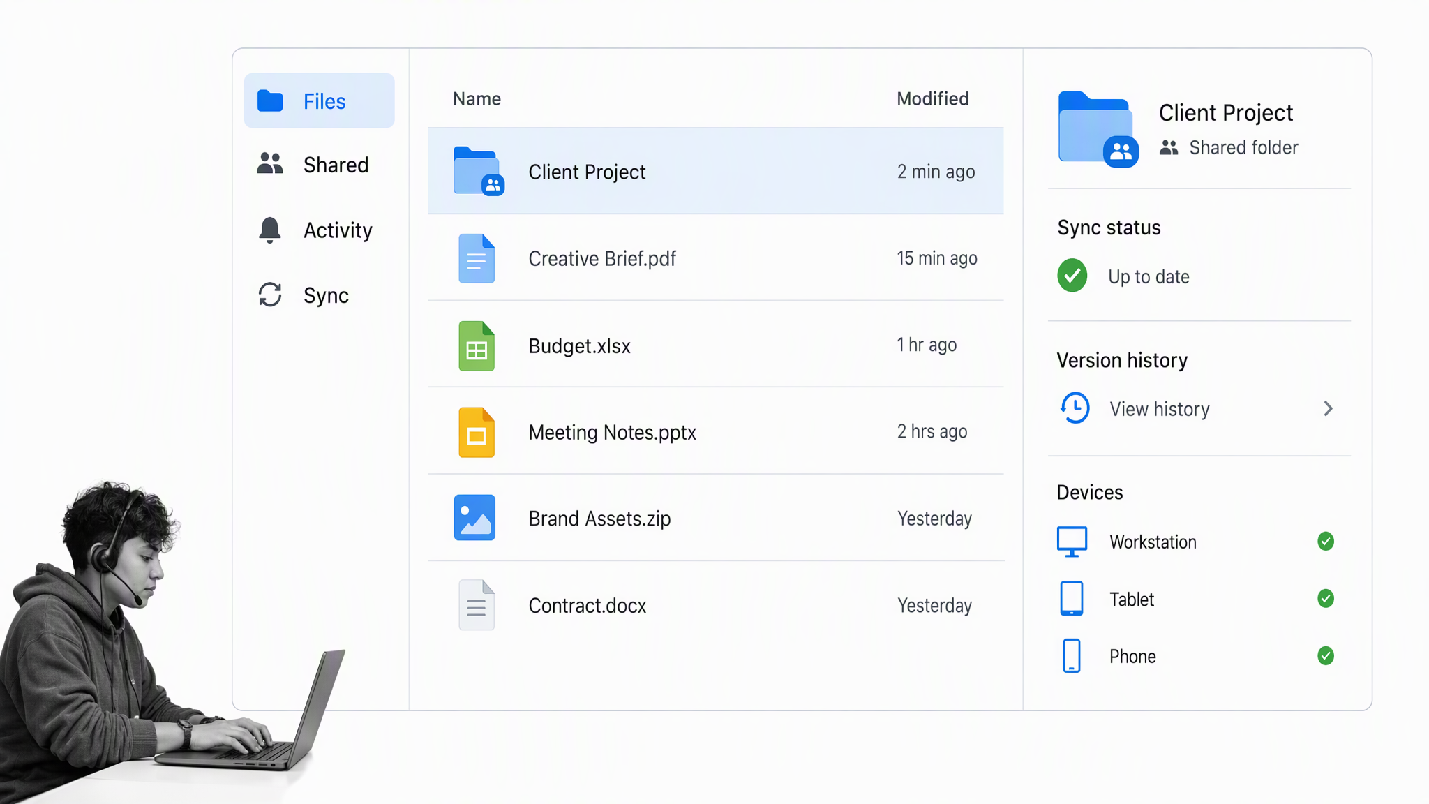 Dropbox brand-neutral file sync workspace with a small-business operator reviewing the work